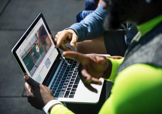 men playing video on laptop